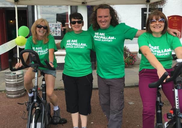 Macmillan static cycle at Fleminig Arms  -  (left to right) Katrina Gibson, Fiona Gibson, Ross Drummond and Anne Gibson