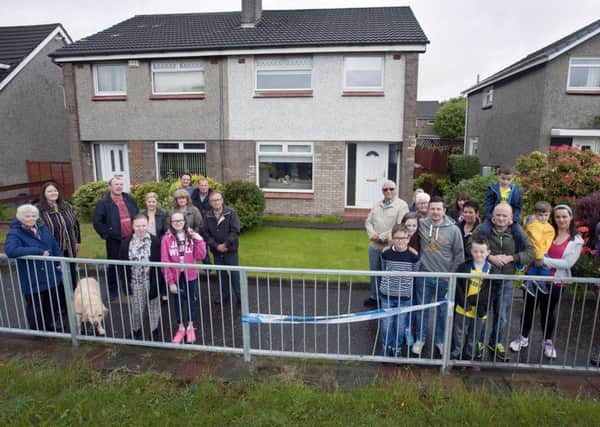 20-06-2015 Picture Roberto Cavieres.   59 Waterside Road, Kirkintilloch  G66 3QW. Photo of Stephen Wright (park round back) and supporters campaigning for safety measures after his home was hit again by an out-of-control driver. Please also include general pic illustrating where speeding drivers are causing chaos at junction of Waterside Road and Bankhead Road.