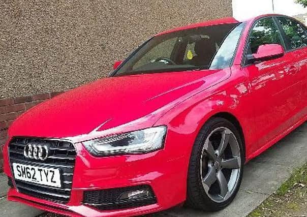 The red Audi that was stolen.