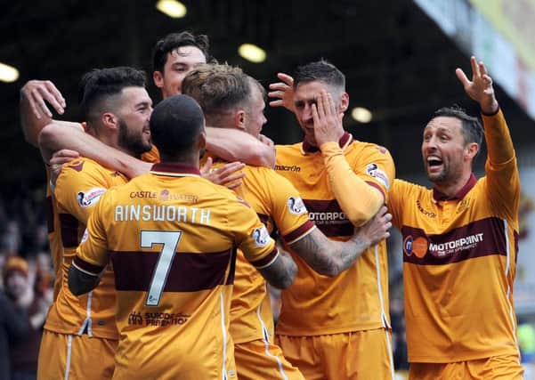 Motherwell players congratulate Richard Tait after the right back's fine goal against Ross County on Saturday (Pic by Alan Watson)