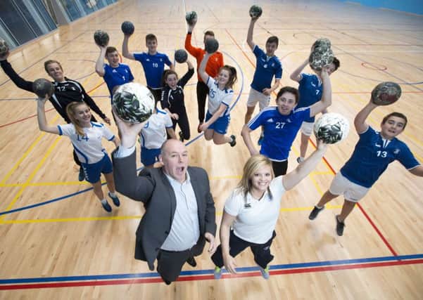 Handball coach Sarah Carrick and Handball Scotland chief Executive Stephen Neilson, both from Cumbernauld, with pupils at Kelvinside Academy.