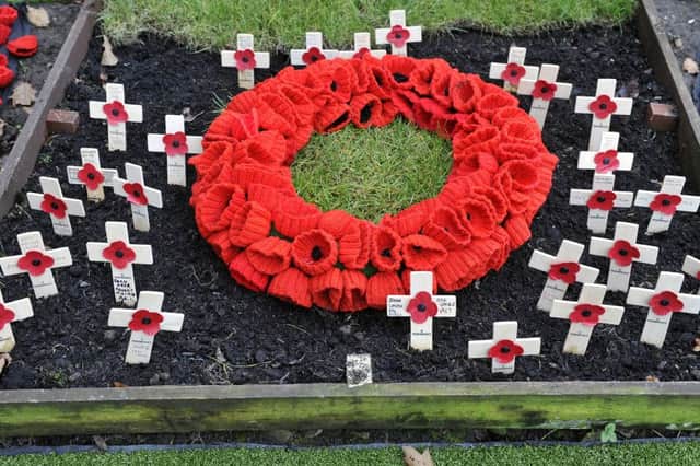 Knitted poppy display in Milngavie