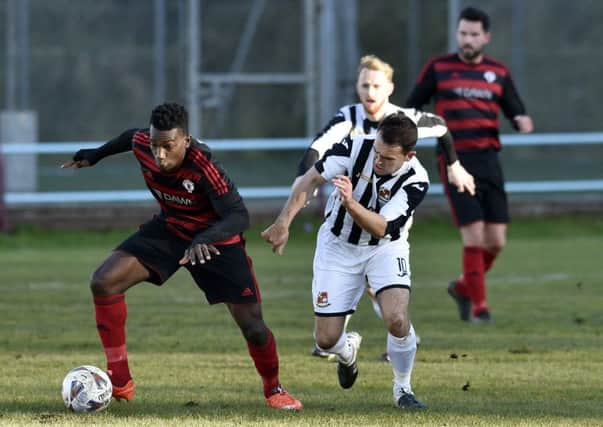 Rob Roy's Amadou Kassarate takes on a Beith opponent during Saturdays match