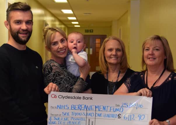 Gio, Linsey and Emillio Ferri present a cheque for Â£6,000 to bereavement specialist midwife/counsellor Elaine Hamilton and clinical services manager for womens services Lyn Clyde.