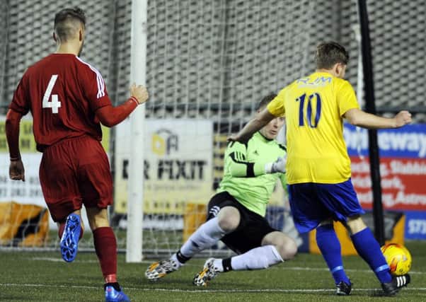 Jonathan Black tries to lift the ball over the Hawick keeper