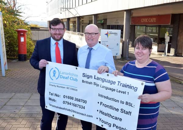 Paul Kelly, depute leader of North Lanarkshire Council, with Ian Galloway and Helen Sneddon of Lanarkshire Deaf Club. Councillor Kelly described their work as truly inspirational and pledged continuing council support.