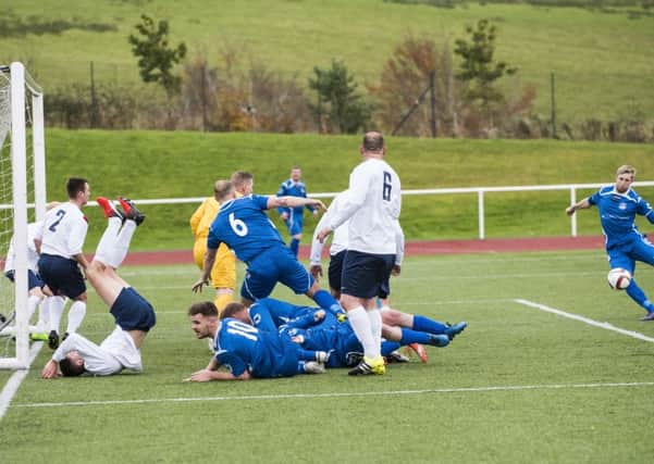 Jonny Wilson shoots home Carluke Rovers' first goal in Saturday's 3-2 home victory over Vale of Leven (Pic by Sarah Peters)
