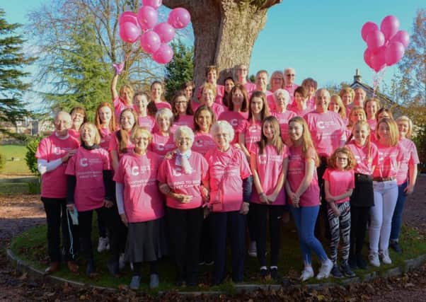 Proud - Gill Murrary and her Cancer Research volunteers at this month's fundraiser