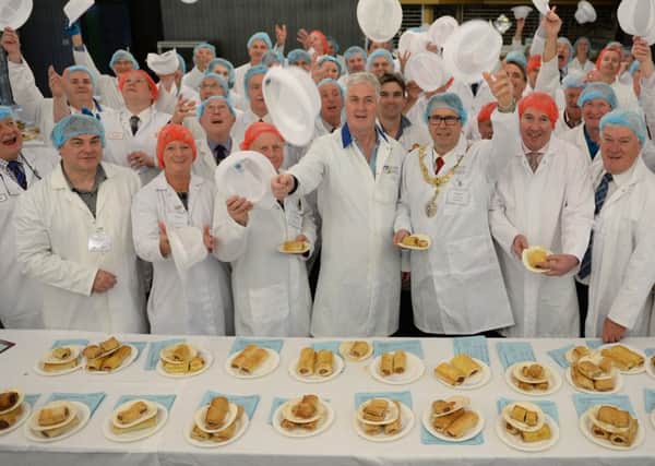 Judges celebrating the end of judging day for this years World Championship Scotch Pie Awards in Dunfermline, Scotland, where 100 contestant bakers and butchers entered 500 pies to be judged.