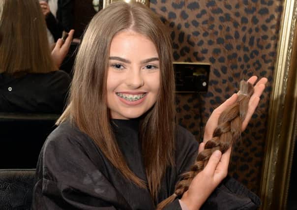 Jenna Sloan with her hair which has been sent to the Little Princess Trust