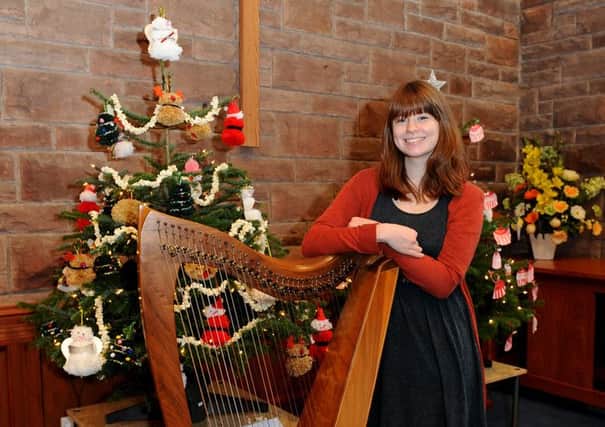 A previous St Paul's Church Christmas Tree Festival - Rachel Rutherford with her Clarsach harp.