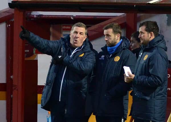 Motherwell manager Mark McGhee (left) has revealed that striker Louis Moult benefited greatly from extra training sessions with Motherwell assistant gaffer James McFadden (centre) (Pic by Alan Watson)
