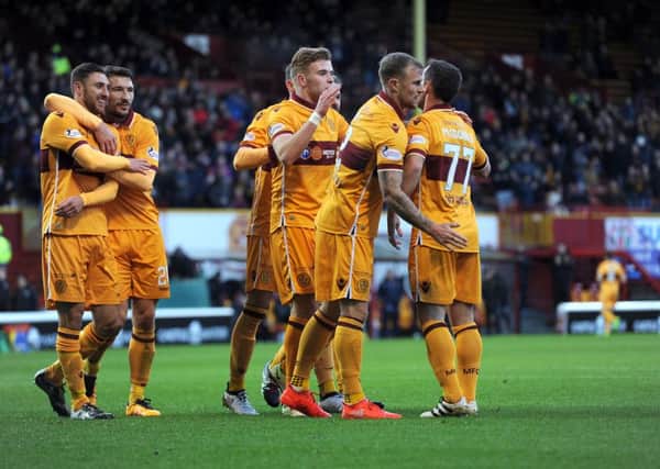 Louis Moult (first left) celebrates with his Motherwell mates after firing his side into a 1-0 lead against Partick Thistle (Pic by Alan Watson)