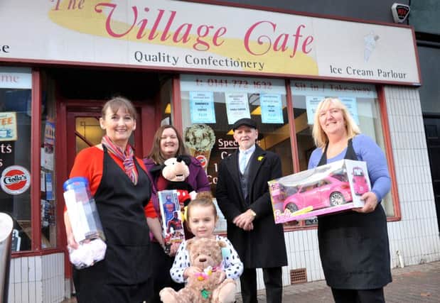 Brenda Young, Debra Haldare, Claire Young, Emily Malloy  and customer Andy Bradley outside the Village Cafe