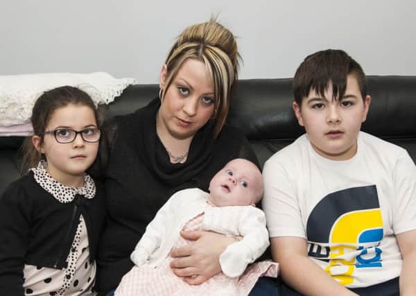 Michelle with children Anthony, Alana and Neve, left without transport after car attack.