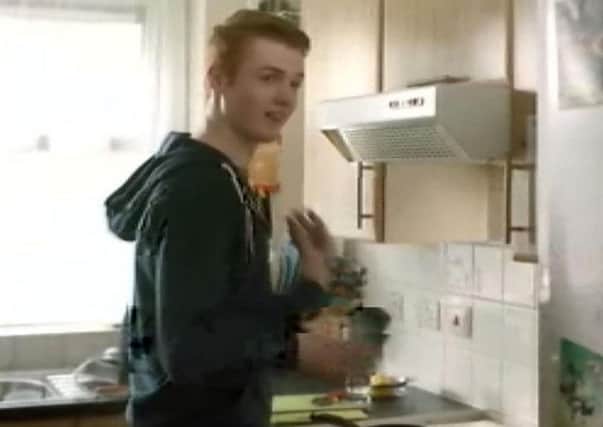 Handout still taken from video issued by the Advertising Standards Authority of a Heinz advert that teaches viewers how to use tin cans to drum out a song which has been banned for encouraging behaviour that risks health and safety.
