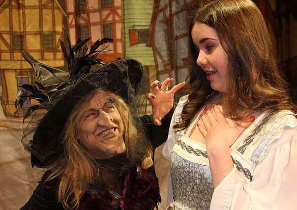 Witch (Iona Goldie) terrifies Belle (Brooke Harwood) in Biggar Panto