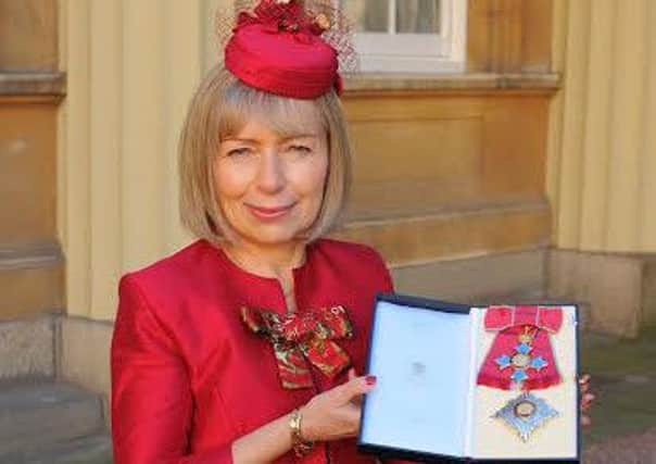 Anna Dominiczak collects her damehood at Buckingham Palace