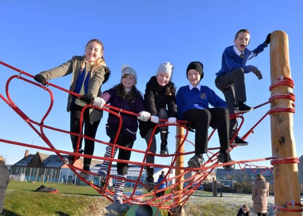 Pupils try out the new play equipment at Netherton Primary