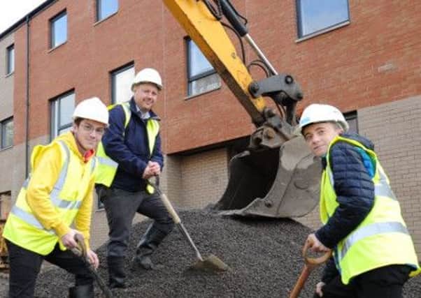 Springburn Academy pupils Sean McInally and Sam Mullen, with Ross Hammell from McTaggart, put their skills to the test.