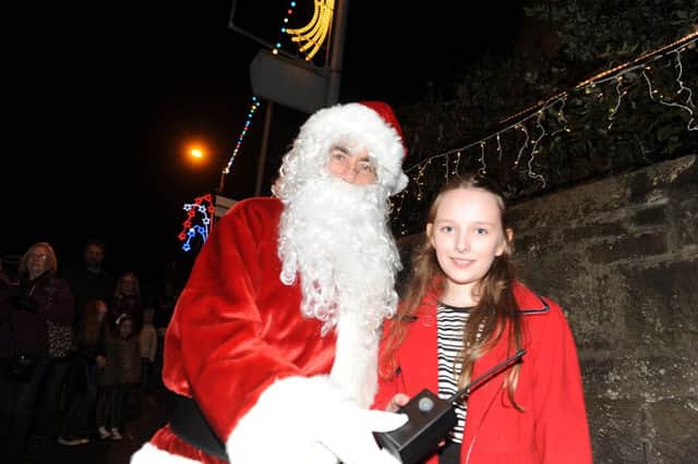 Gala Queen Sophie Stewart switching on the lights with Santa.