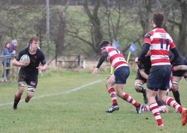 Biggar Rugby Club's Jamie Orr finds himself in an unusual spot on the wing but regrettably couldn't outpace a tight Peebles defence. Biggar lost this home league derby 23-9 on Sat. Dec 10 2016 (Pic by Nigel Pacey)