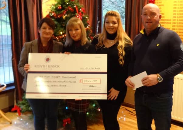 British Heart Foundation area manager Shirley Stenhouse receives the Kilsyth Lennox donation from club president David Napier, Elaine Bankier and daughter Holly.