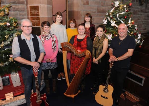 St Paul's Church annual Christmas Tree Festival. Heather Downie - Royal Conservatoire of Scotland with her pupils along with church members Robert Rutherford and Douglas Muirhead.