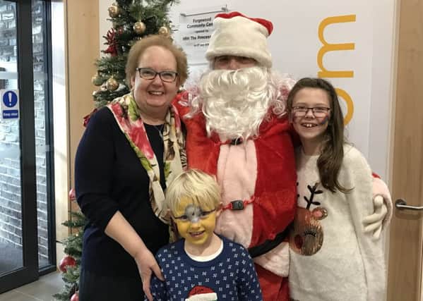 Motherwell and Wishaw MP Marion Fellows joins Santa as he meets youngsters Ben and Amy Fotheringham