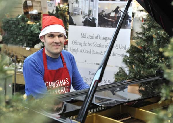 Dobbies Garden Centre, Sam Rea Peoples who is partially sighted playing the grand piano