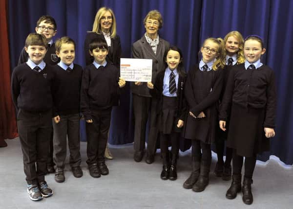 St Joseph's Primary, cheque presentation to school in Malawi.
Head teacher Mrs Duns giving cheque to Dr. Jo Thorp.