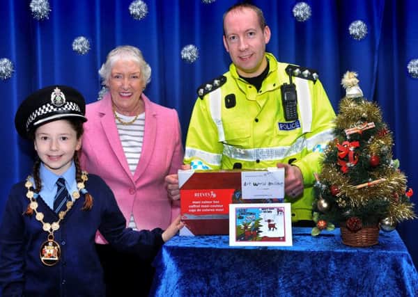 19-12-2016 Picture Roberto Cavieres. 
MILNGAVIE. St Joseph's Primary - WINNER of the police Christmas card competition Anastasia McLaughlin with chief inspector Smith, Provost  Una Walker