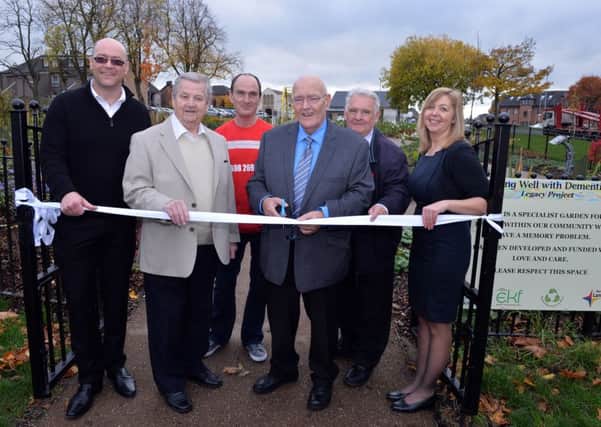 A ribbon was cut to mark the official opening of the Dementia Garden in Motherwell from left: Mark Smillie, Director of the Environmental Key Fund; Matt Moorcroft from Motherwell who has contributed to the creation of the garden; Graeme Miller from Miller Cycles, Wishaw who organised a team of 23 volunteers who raised around Â£4,000 by cycling from Glasgow to Edinburgh; Councillor James Coyle, Convener of Planning and Transportation; Councillor Thomas Lunny; and Charge Nurse Hazel Boyle.