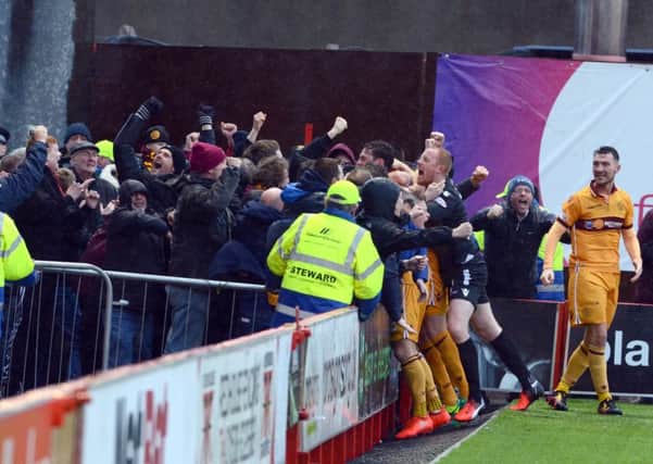 Motherwell players celebrate with the visiting fans after Louis Moult's dramatic last gasp equaliser at Hamilton Accies (Pic by Alan Watson)