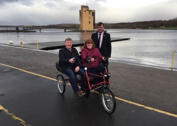 Councillor Paul Kelly with Jim Brannigan and his daughter Megan as they used the DisabledGo website to check out the facilities in Strathclyde Park.