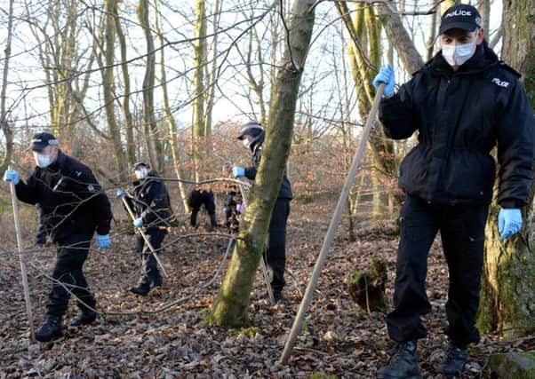 Police searching for clues in Milngavie woods.