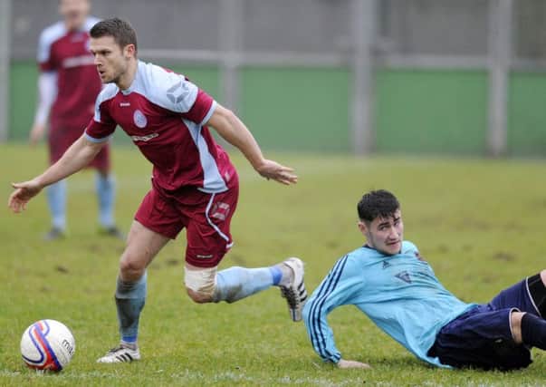 Simon Eeles gets away from a Shotts opponent