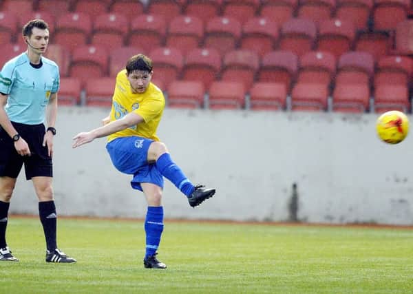 Jonathan Black hammers home Colts' first goal against Dalbeattie Star