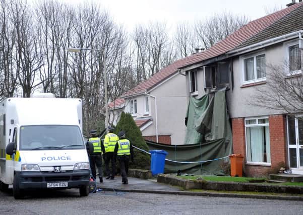Police at the scene of the deliberate house fire in Achray Place, Milngavie.