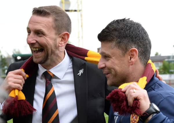 Ian Baraclough (left) and his then assistant manager at Motherwell, Steve Robinson, celebrate beating Rangers 6-1 on aggregate two seasons ago (Pic by Alan Watson)