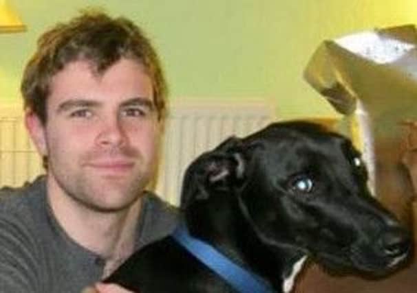 Cameron Logan, with the family's pet dog which also died in the January 1 incident