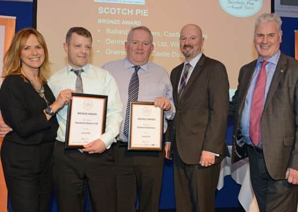 World Championship Scotch Pie. 2017. Denholm Bakers Ltd bakery manager David Dunion (second, left) collects bronze award from Carol Smillie. Pic: SWNS