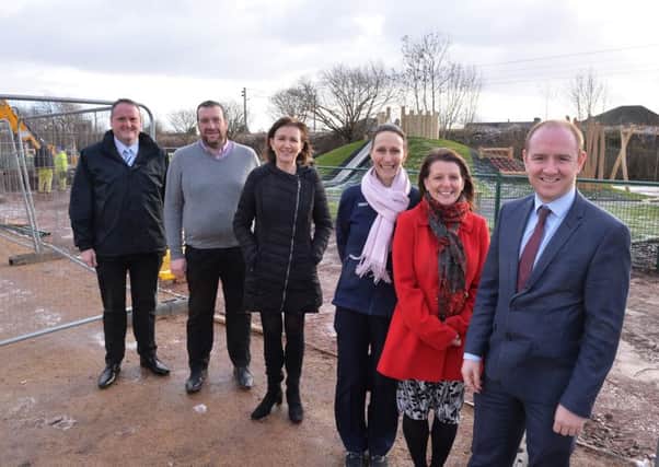 Visiting Hope Street Play Park in Mossend are (l-r): Matt Costello (NLC local regeneration manager), Thomas Glavin (Holy Family Primary parent council), Frances Wilson (Holy Family Primary head teacher), Nadine Pender (Tesco, Bellshill), Angela Paterson (Mossend Primary head teacher) and Councillor Frank McNally as the work nears completition.
