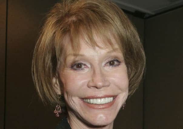 FILE - This Sept. 19, 2015, file photo shows Mary Tyler Moore at the 26th Annual News and Documentary Emmy Awards ceremony in New York. Moore died Wednesday, Jan. 25, 2017, at age 80. (AP Photo/Tina Fineberg, File)