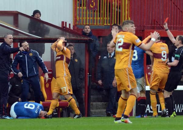Motherwell's Scott McDonald puts his hands on his head after being sent off during the 2-0 Scottish Premiership defeat against Rangers (Pic by Alan Watson)