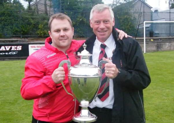 Frame (left) with Thorniewood vice-president Drew Russell after their Central League Cup victory in 2015.
