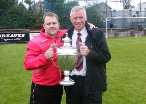 Ex-Thorniewood Utd gaffer Andy Frame is pictured with vice president Andrew Russell after the club's 2015 Sectional League Cup win