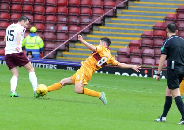 The challenge which got Carl McHugh sent off for Motherwell against Hearts (Pic by Alan Watson)