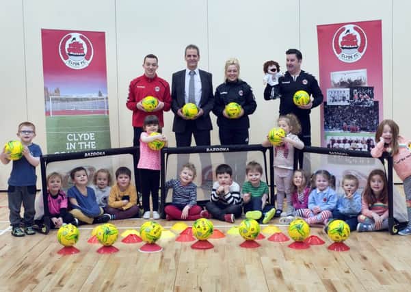 Stepps youngsters with Clyde FC Community Foundation's Tom Elliott, Cara McBearty and Cameron Cairney and David Wilson of sponsors Advance Construction.