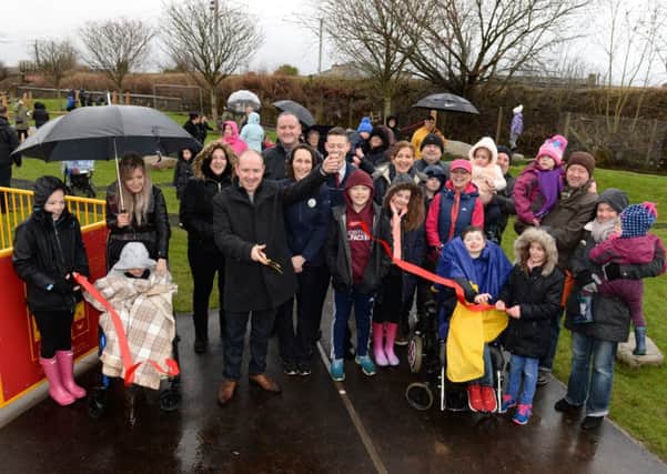 Mossend and Holytown councillor Frank McNally cuts the ribbon at Hope Street Play Park in Mossend